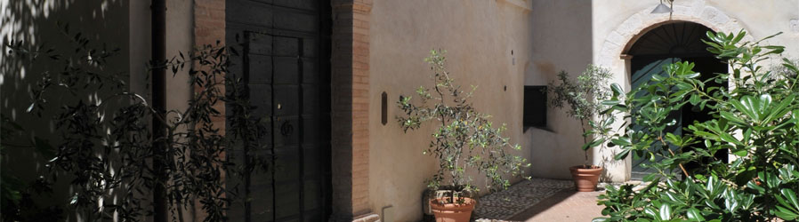 Santi Terzi - Courtyard and main entrance